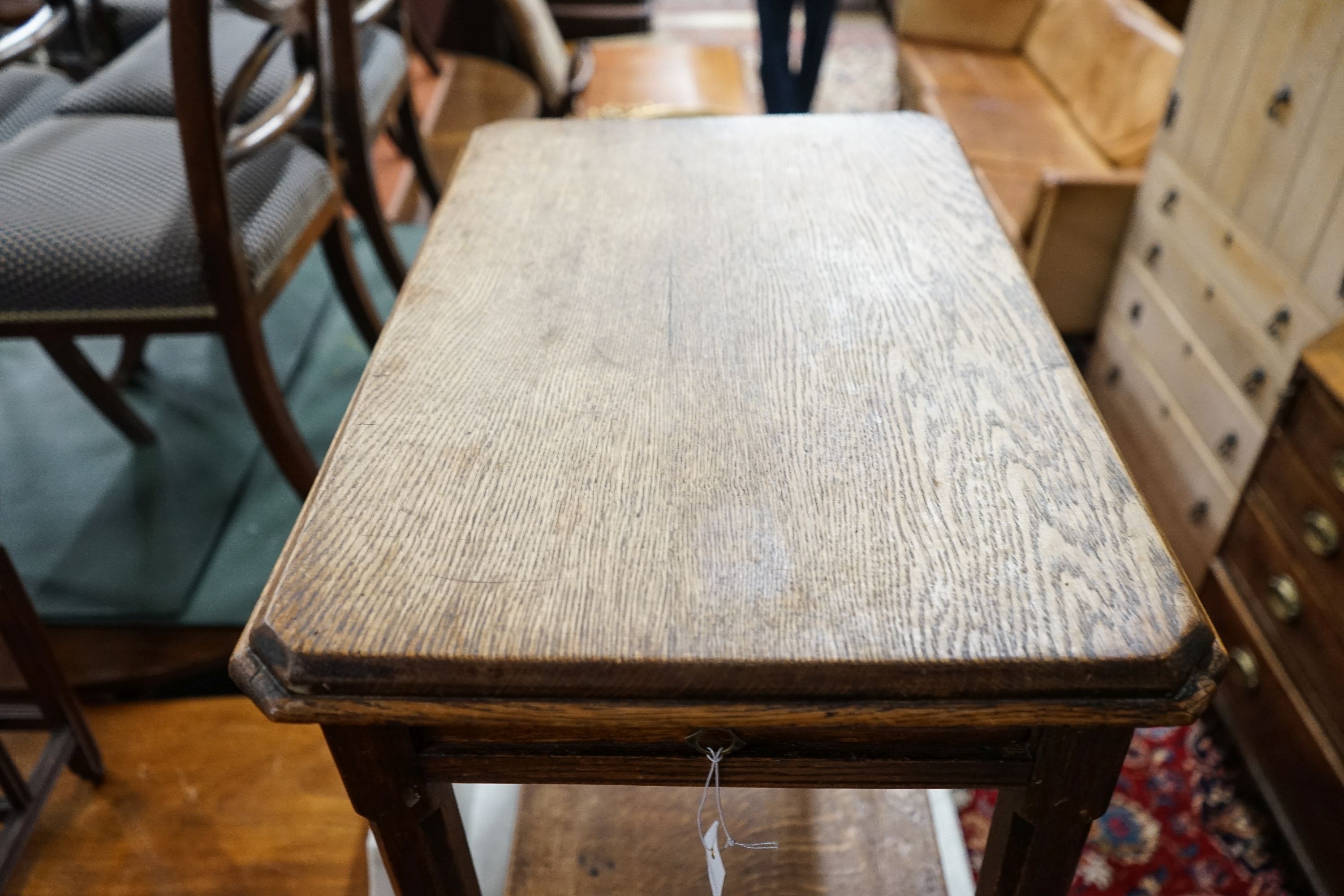 A Victorian Aesthetic movement oak two tier side table, width 62cm, depth 40cm, height 73cm